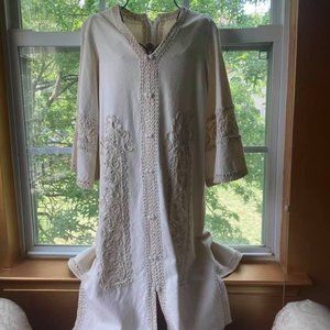 Cream colored embroidered dress (no tags). Preowned condition.